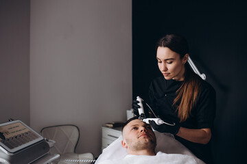 Rejuvenating face treatment. A man in a beauty clinic.treatment.