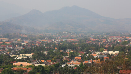 Fototapeta na wymiar Unhealthy air pollution during the dry season, due to agricultural burning and road traffic in Luang Prabang, Laos.