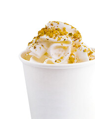 Coffee with pistachios and cream in a paper cup
