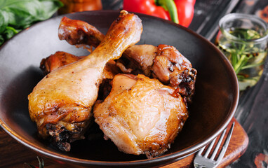 Fried chicken on the plate with tomatoes