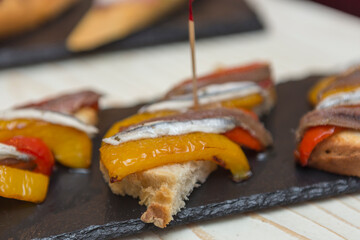 Close up on spanish tapas starters served on a table top. No people are visible. - 603632878