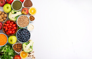 Fototapeta na wymiar Fresh Ingredients for Dietary, Vegetables, Fruits, Nuts, Meat for Weight Loss on White Background