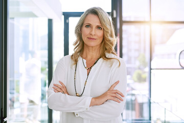 Crossed arms, office and portrait of business woman with confidence, empowerment and career pride. Corporate, management and face of senior female worker with future vision, mission and motivation