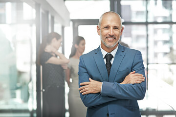 Businessman, portrait smile and arms crossed in leadership or team management at the office. Happy and confident man person, manager or corporate CEO executive smiling in small business confidence