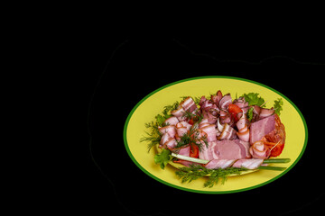 Pork delicacies on a black background.