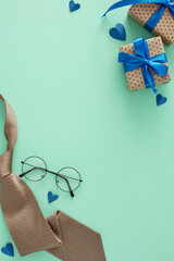 Happy Father's Day concept. Top view vertical flat lay of modern necktie, gift boxes with ribbon,...