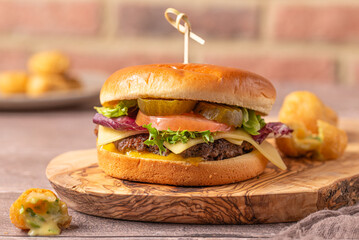 Ultimate Beef Burger Bliss: Savor the Juicy Perfection of a Flame-Grilled Patty, Topped with Gourmet Fixings and Irresistible Melted Cheese