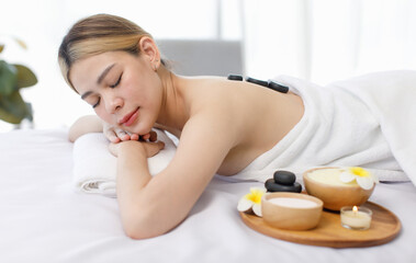 Portrait shot of Millennial Asian young beautiful relaxing resting nude naked woman laying lying...