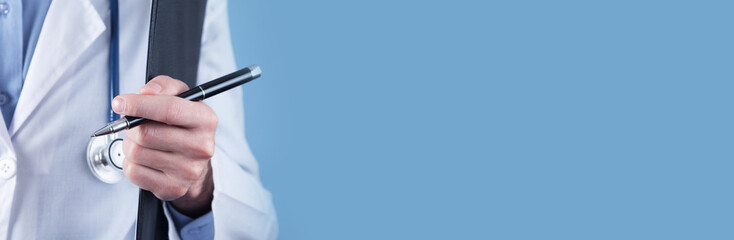 Medical doctor holding pen and clipboard.