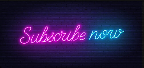 Subscribe Now neon sign on brick wall background.