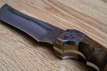 Damascus steel knives on a black background. Kitchen knives. background with japanese knife. A set...