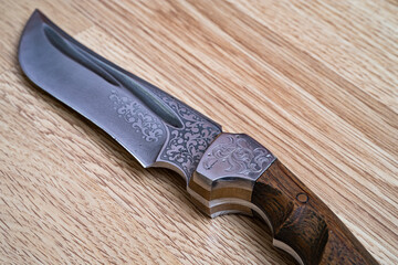 Damascus steel knives on a black background. Kitchen knives. background with japanese knife. A set...