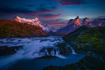 Beautiful mountain scenery with Salto Grande Waterfall at Torres del Paine National Park, Patagonia in Chile during sunrise time.