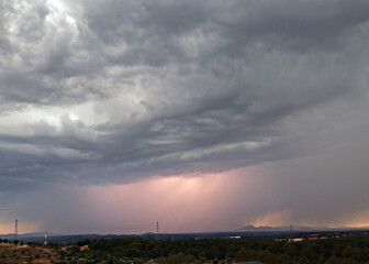 photography of a summer thunderstorm with lightning, threatening background color