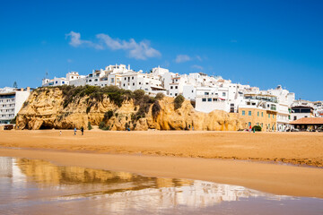 Great view of Fisherman Beach, Praia dos Pescadores, with whitewashed houses on cliff, Albufeira, Algarve, Portugal