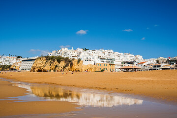 Great view of Fisherman Beach, Praia dos Pescadores, with whitewashed houses on cliff, Albufeira, Algarve, Portugal