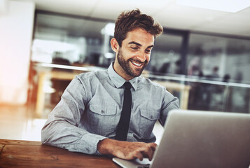 Happy businessman, laptop and typing email for communication, schedule or networking at office. Male person or employee working with smile on computer in project or social media browsing at workplace