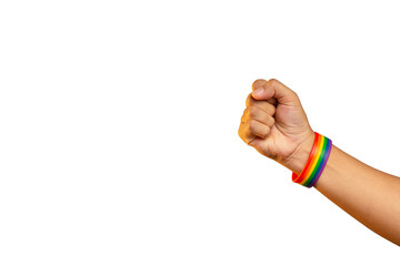 Hand fist with a rainbow wristband in a hand while standing against a transparent background