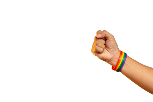 Hand fist with a rainbow wristband in a hand while standing against a transparent background - Powered by Adobe