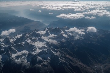 Fototapeta premium View of the snow-capped mountains from the airplane window -Ai