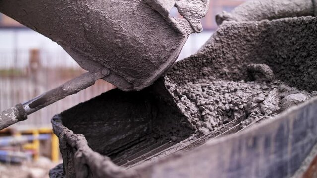 Concrete pours from a mixer