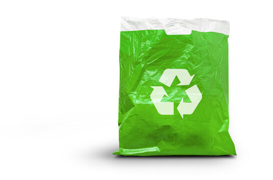 Close up of a used green plastic bag and recycle symbol isolated on a  transparent background
