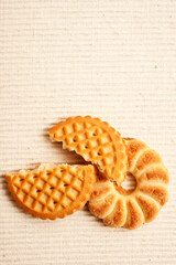 several butter cookies or biscuits, some of them broken like food concept of delicious bakery sweet products