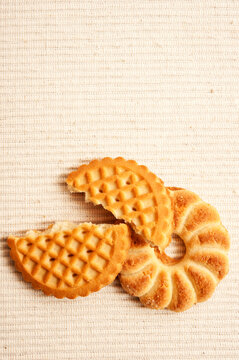 several butter cookies or biscuits, some of them broken like food concept of delicious bakery sweet products