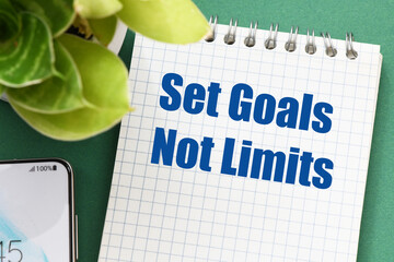 set goals not limits words in notebook.