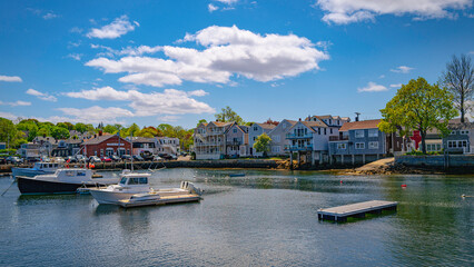 Boats mooring in the Rockport Harbour, tranquil coastal village landscape at sunrise in Cape Anne,...