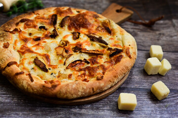 Tasty hot italian focaccia  pizza   with porcini mushroom,and cheese. Pizzeria menu. Concept poster for Restaurants or pizzerias. Top view