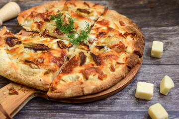 Tasty hot italian focaccia  pizza   with porcini mushroom,and cheese. Pizzeria menu. Concept poster for Restaurants or pizzerias. Top view