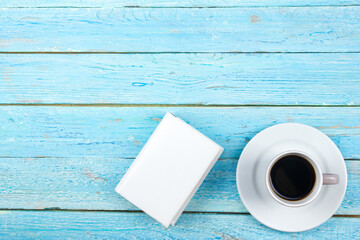 Blue office desk table with computer, pen and a cup of coffee, lot of things. Top view with copy space.