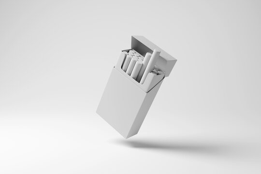 White cigarette packet floating in mid air on white background with shadow in monochrome. Illustration of the concept of smoking habit