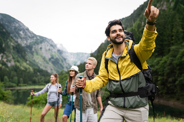 Hiking with friends is so fun. Group of young people with backpacks together