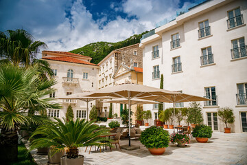 Fototapeta na wymiar Cozy patio in the street of one of the most beautiful town in Montenegro - Perast
