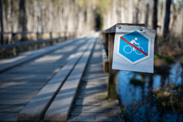 Bicycle restriction concept: sign that restricts biking on certain area in the woods (selective...