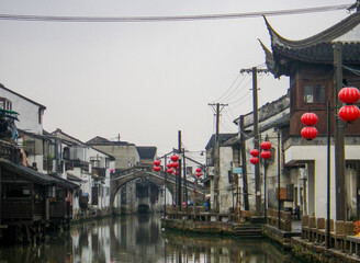 lantern lined water canal with bridge in suzhou china