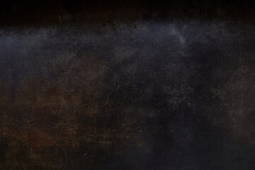 Dark brown surface made of artificial leather with scratches. Background with scratch surface texture. Grunge background. Overlay for your design with copy space. High quality photo