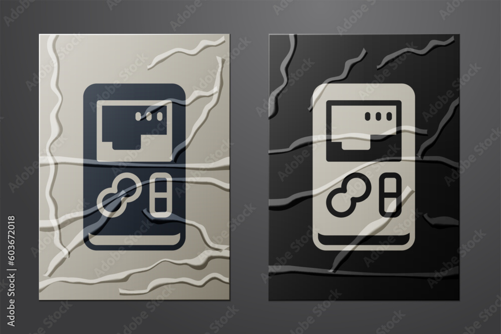 Poster white portable video game console icon isolated on crumpled paper background. handheld console gamin