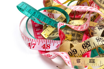 Measuring tapes on white background.