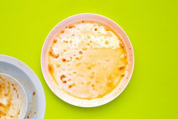 Dirty dishes on green background. Top view