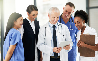 Digital tablet, team and group of healthcare workers in discussion on xrays in medicare clinic. Collaboration, diversity and professional medical employees analyzing a diagnosis on mobile in hospital