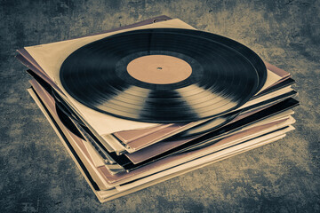 Fototapeta premium Vintage vinyl record on grunge background, retro toned.