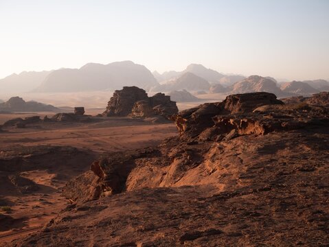 Wadi Rum desert with rock formations and golden sands. © microice