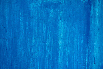 An old sheet of metal painted with blue paint, time and the environment changed the color of the paint in some places, in some places the paint cracked
