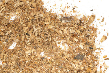 Wood texture shavings and sawdust isolated on white background . Pile of sawdust close up top view.