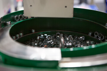 Spin type high speed material parts feeder. Industrial manufacturing.