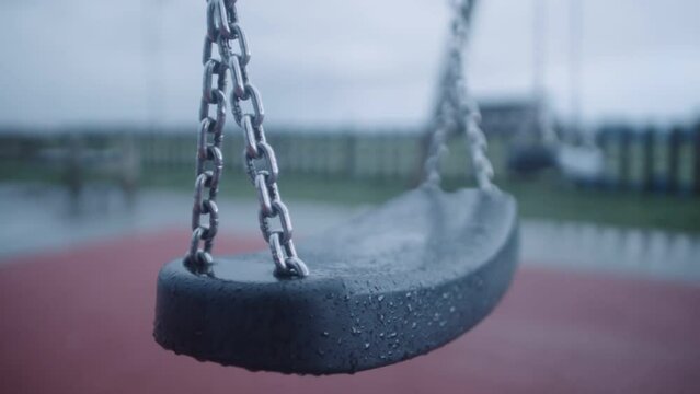 Haunting lonely images of swings in a cold, empty playground