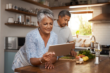 Internet, old woman at kitchen counter with man and tablet, cooking healthy food together in home....